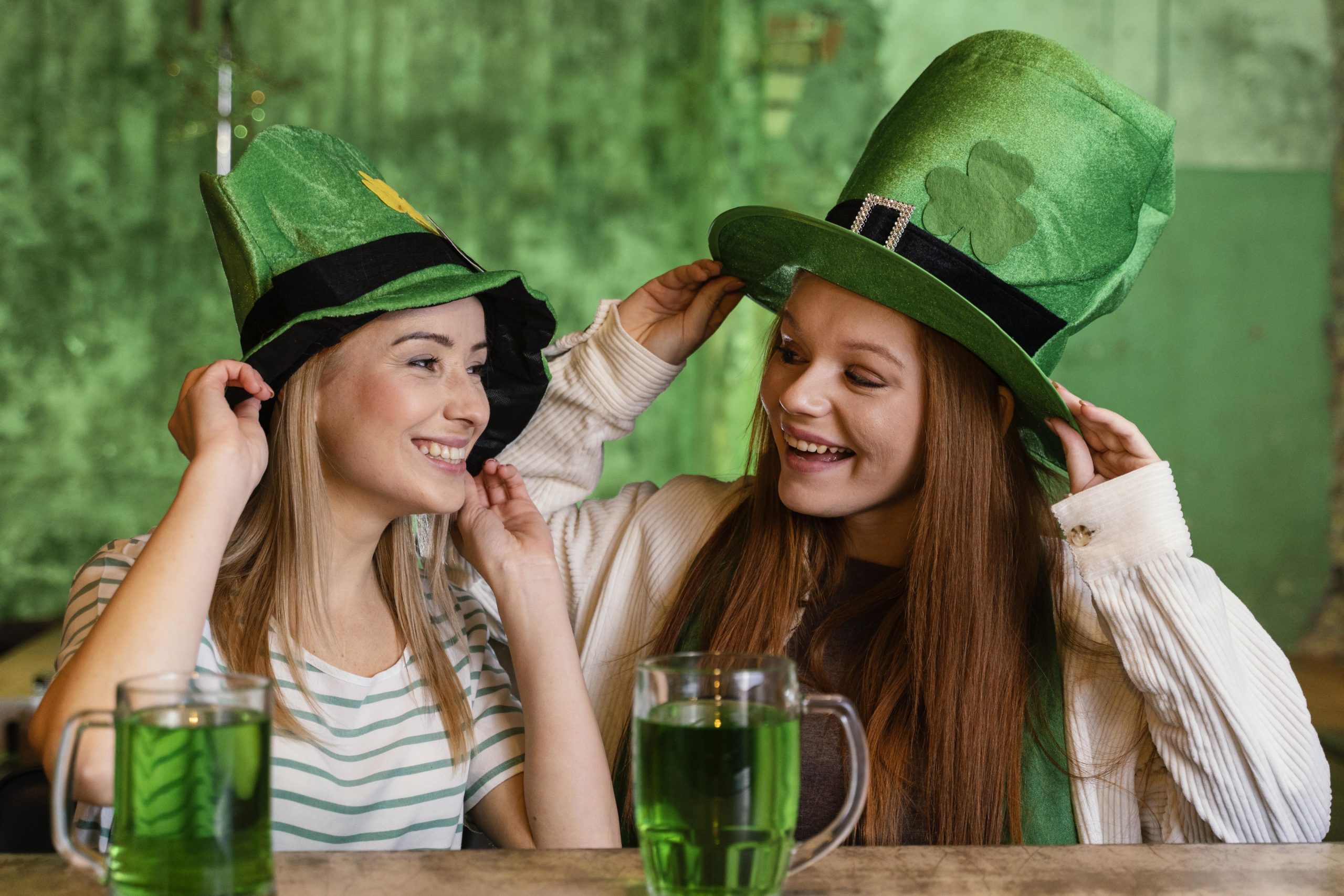 happy-female-friends-celebrating-st-patrick-s-day-together-at-the-bar